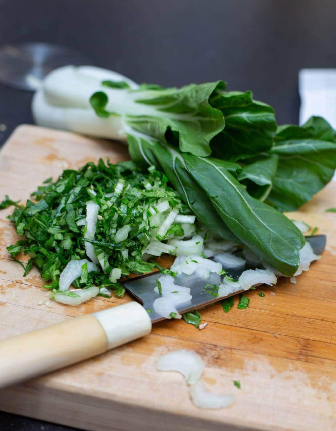 Paksoi is één van de groenten die de Thaise kokossoep zo lekker maken